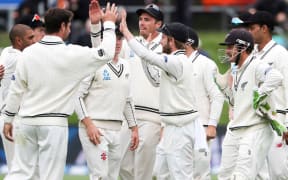 The Black Caps celebrate Kane Williamson's a catch to dismiss Dean Elgar.