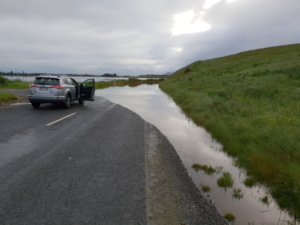 A road to Henley is cut off after heavy rain flooded Otago.