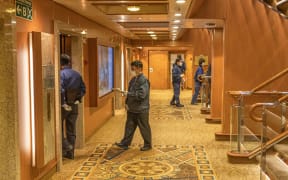 Health officials on board the Diamond Princess cruise ship.
