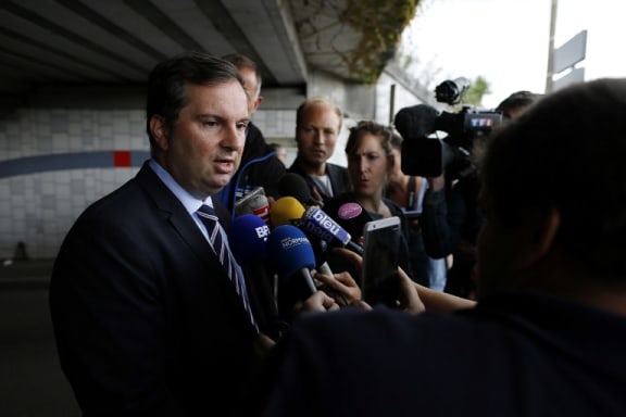 French Interior Ministry spokesman Pierre-Henry Brandet arrives at the scene.