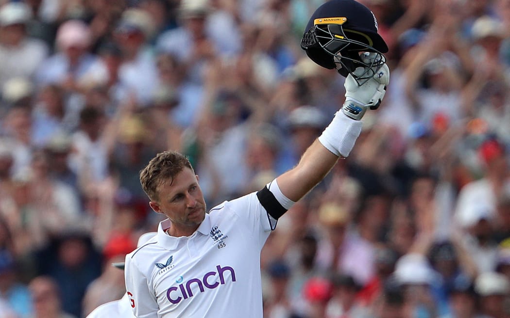England's Joe Root celebrates scoring a century on the opening day of the first Ashes cricket Test match between England and Australia at Edgbaston in Birmingham.