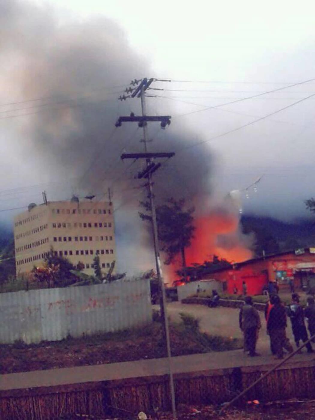 A building burns in Mendi during a period of political unrest.