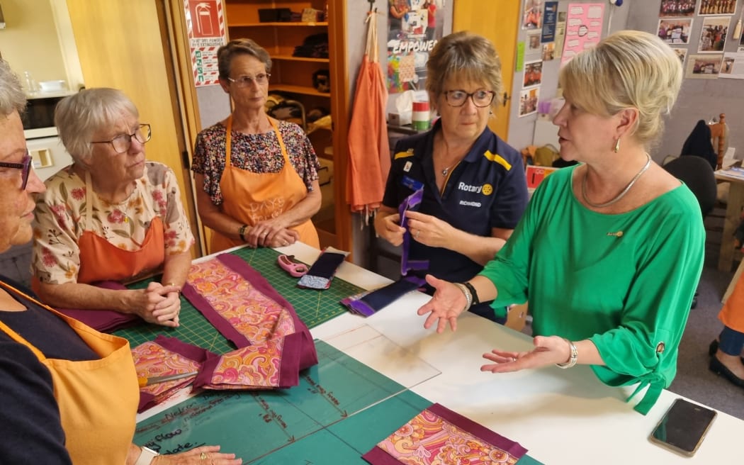 Days for Girls volunteers talk to former Rotary International president Jennifer Jones.