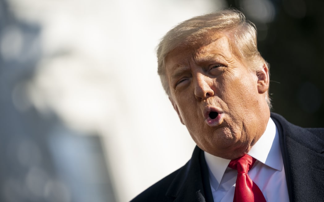 WASHINGTON, DC - JANUARY 12: U.S. President Donald Trump speaks to reporters on the South Lawn of the White House before boarding Marine One on January 12, 2021 in Washington, DC.