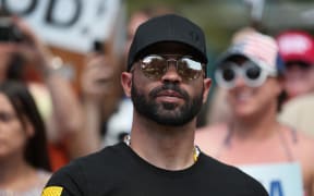 ORLANDO, FLORIDA - FEBRUARY 27: Enrique Tarrio, leader of the Proud Boys, stands outside of the Hyatt Regency where the Conservative Political Action Conference is being held on February 27, 2021 in Orlando, Florida.