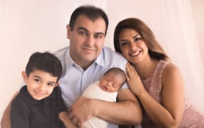 A family picture showing father Siamak, mother Mohadeseh and their son's Arteen (left) and Radeen (center) before the crash last Easter weekend which killed both Arteen and Radeen.