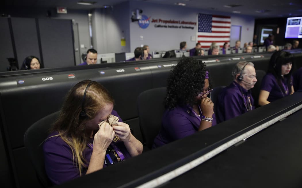 JPL staff react as the probe loses signal for the last time
