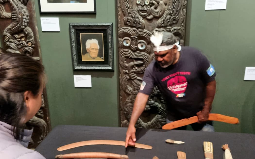 Stone knives, an adze and a boomerang belonging to the Warumungu people, the traditional custodians of the Tennant Creek region in the Northern Territory.