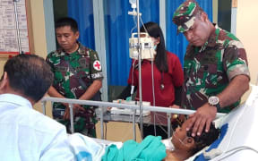 The Indonesian military’s Cenderawasih district chief commander Herman Asaribab visiting victims of Puncak shootings in hospital.
