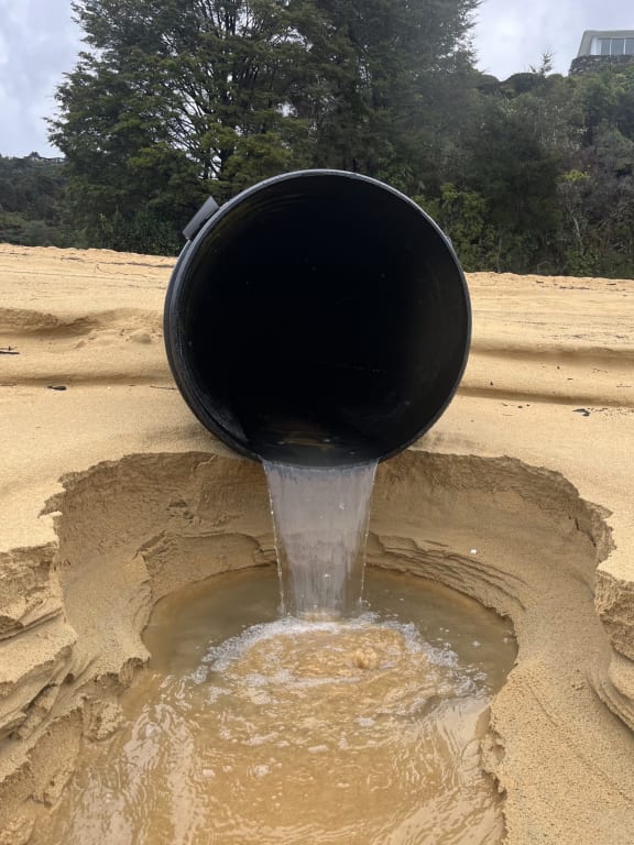 Human contamination at Kaiterieri Beach has been traced back to the stormwater pipe that discharges onto the beach. Photo: supplied/Bradley Reichert.