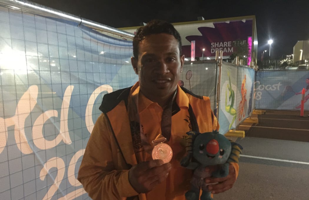 Morea Baru with his medal.