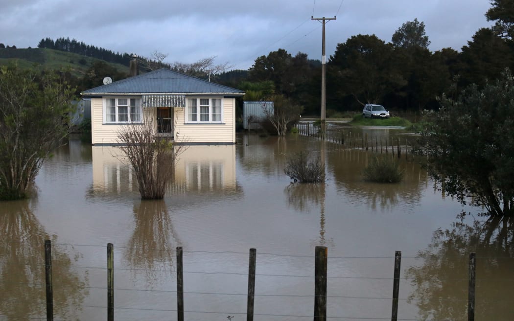 A home on Ōtiria Road surrounded by floodwaters in 2020.