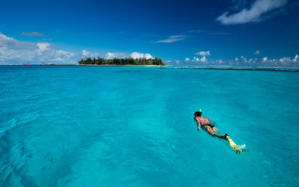 A snorkeler enjoys the waters of the CNMI