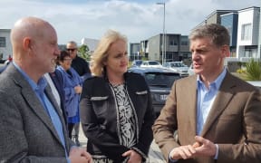 Bill English (right) at the Hobsonville housing development with Social Housing minister Amy Adams (centre) and real estate salesperson Mike Pearce (left).