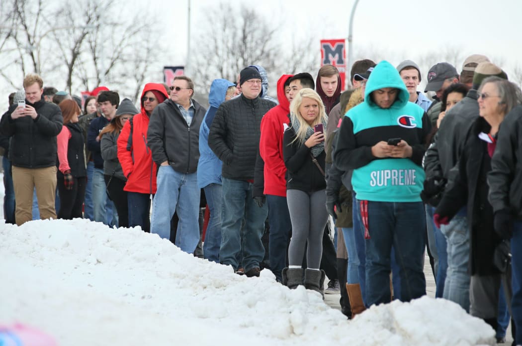Supporters queue for US Republican presidential candidate Donald Trump in Marshalltown, Iowa on 26 January 2016.