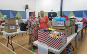 Glenda Marshall (left), Christchurch Methodist Mission administrator, and Jill Hawkey, the mission's executive director are helping to keep track of the hampers arriving and departing on the big day.
