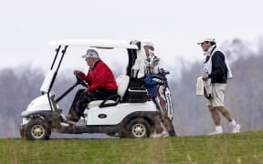 STERLING, VIRGINIA - NOVEMBER 21: US President Donald Trump golfs at Trump National Golf Club on November 21, 2020in Sterling, Virginia.