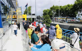 People queue to enter IKEA on its opening day in Auckland