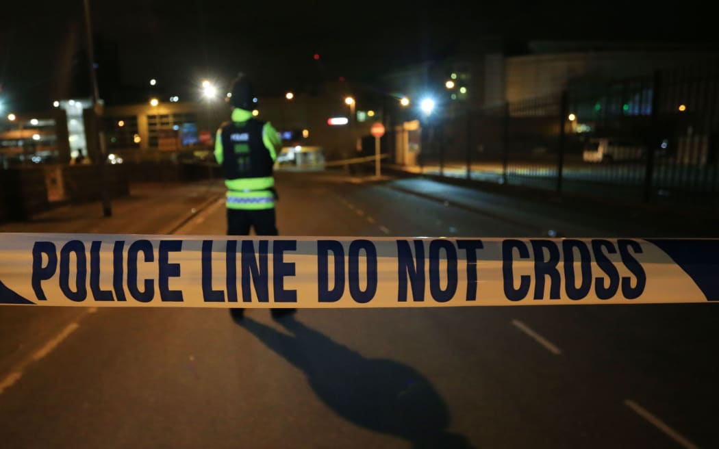 British police guard the entrance to the Manchester Arena stadium in Manchester, United Kingdom on May 23, 2017.