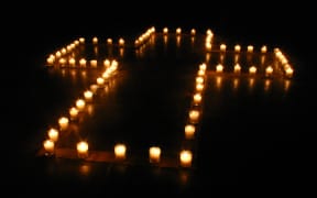 Cross of candles. arrangement made by Yun-Yu Hsieh and people from Austin Chinese Campus Christian Fellowship (ACCCF); at Gonzales, Texas, USA.