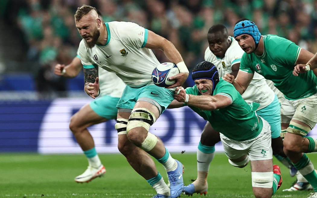 South African RG Snyman attempts to break away from Ireland's lock Ryan Baird during the Rugby World Cup pool match between South Africa and Ireland at the Stade de France.