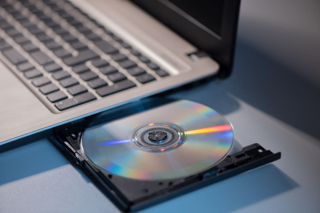 A laptop with compact disc close up shoot