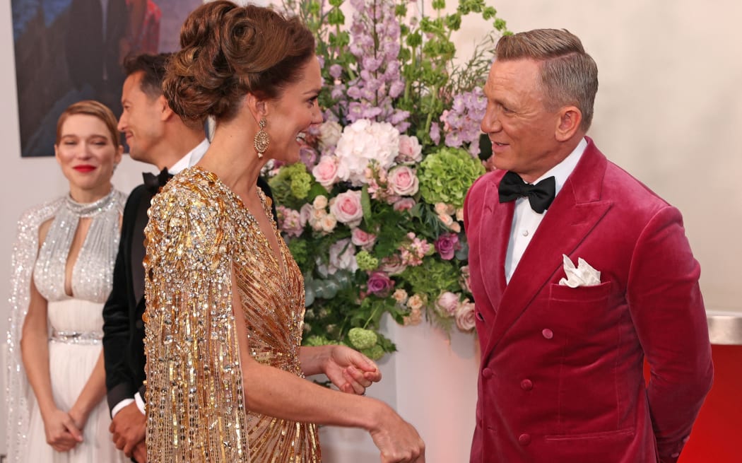 Britain's Catherine, Duchess of Cambridge (L) meets with English actor Daniel Craig ahead of the World Premiere of the James Bond 007 film "No Time to Die" at the Royal Albert Hall in west London on September 28, 2021. -