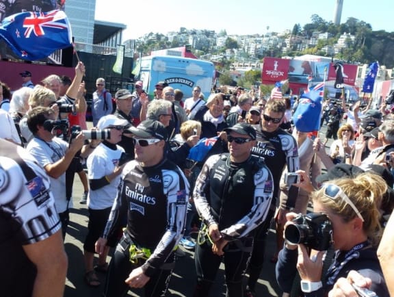 Glenn Ashby, tactician Ray Davies (middle) and skipper Dean Barker heading for the pre-race show.
