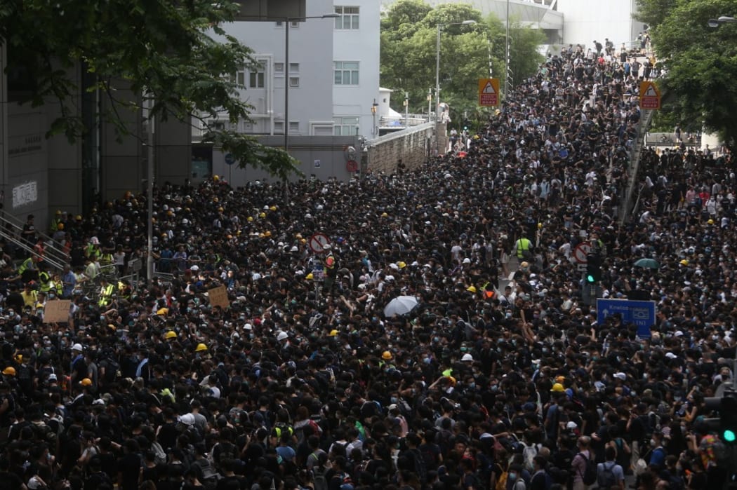 Protesters, mostly students, gather outside the police headquarters in Hong Kong on Friday June 21, 2019