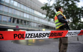 Police block the entrance to a Munich train station following the shootings.
