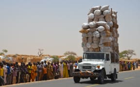 An overloaded car travels through Assaga refugee camp in Diffa on May 17, 2016, close to the Niger-Nigeria border.