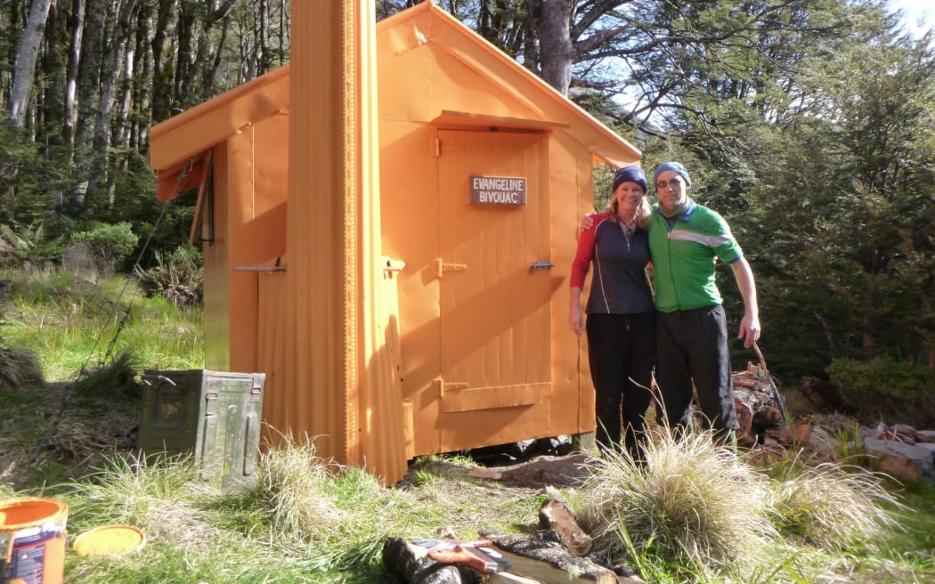 Tracey Polglaze and Richard Janssen outside the restored Evangeline Bivvy.