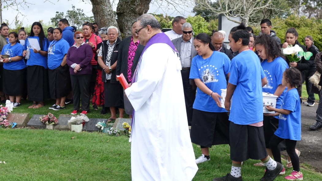 Members of a Mangere youth group carry Mona's coffin.