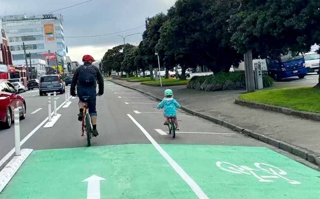 Paul Wilson and his daughter Iris, on a trip down the new Cambridge Terrace cycle lane.
