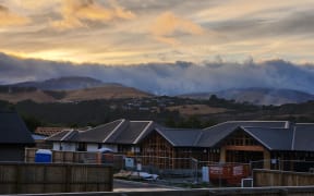 Sunrise over Port Hills fire scene - day 4