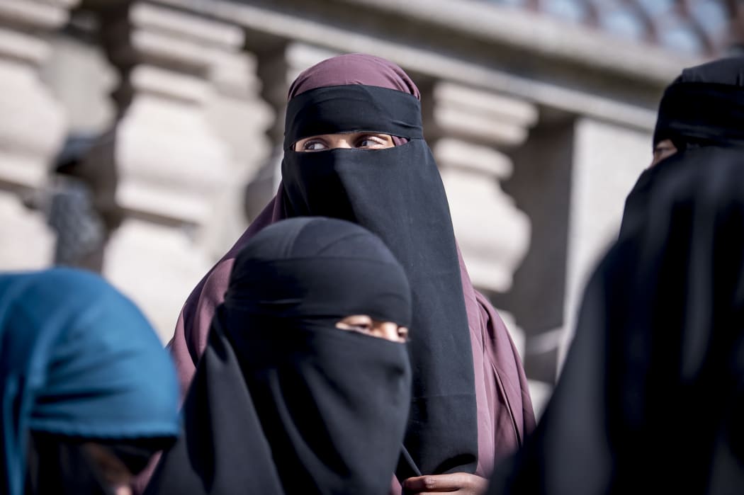 Women wearing niqab exit the Danish Parliament in Copenhagen, Denmark, on May 31, 2018.
