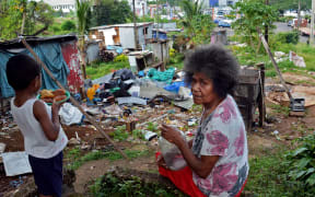 Olivia Finau and her grandson, Lagilagi settlement at Jittu Estate, Suva, Fiji.