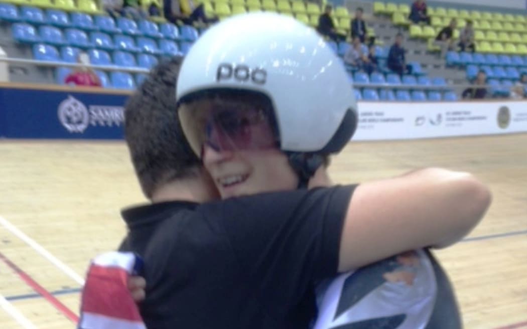 Campbell Stewart is congratulated by coach Ross Machejefski after winning the omnium world title