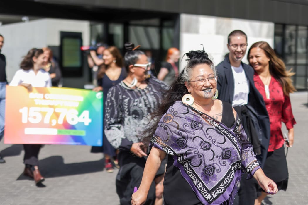 Dr Elizabeth Kerekere joins marchers in support of a ban on conversion therapy.