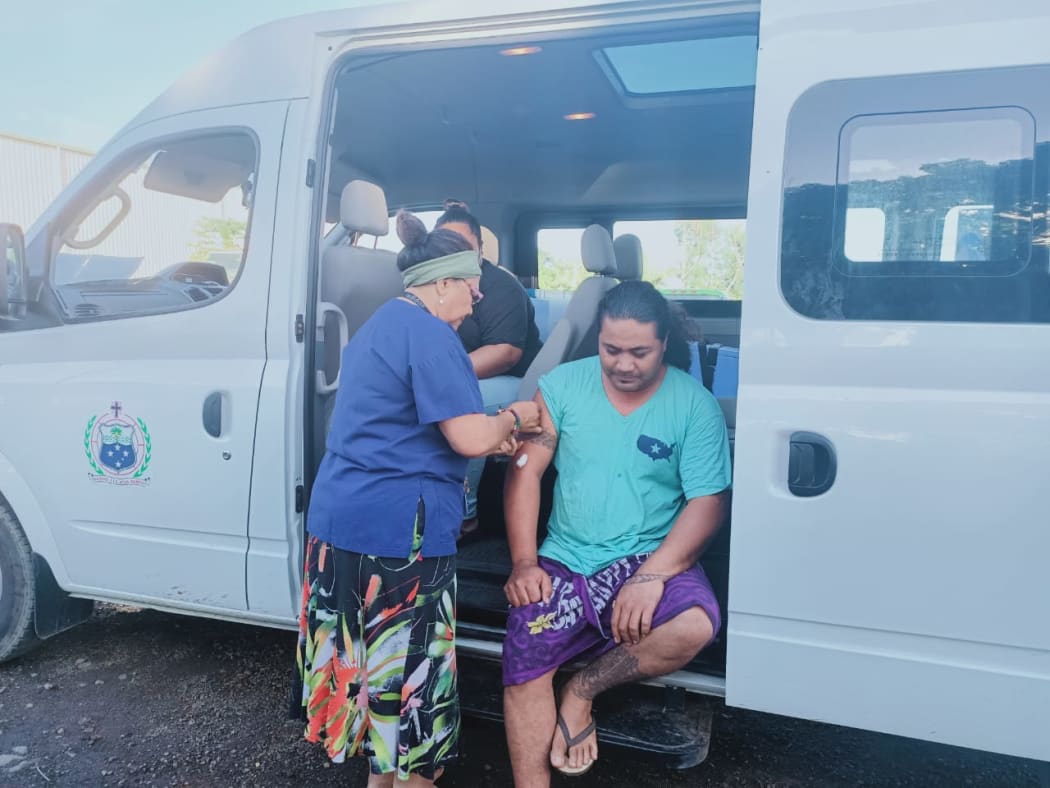 A nurse administers a shot during the mass vaccination campaign