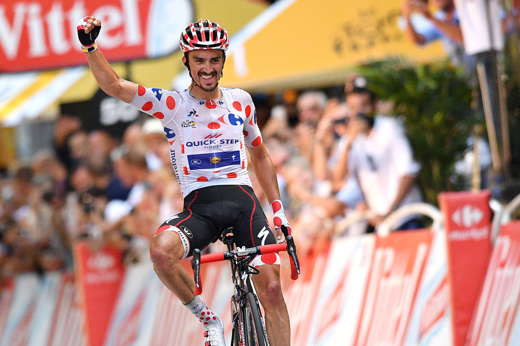 French Julian Alaphilippe of Quick-Step Floors wearing the red polka-dot jersey celebrates as he crosses the finish line to win the 16th stage of the 105th edition of the Tour de France cycling race.