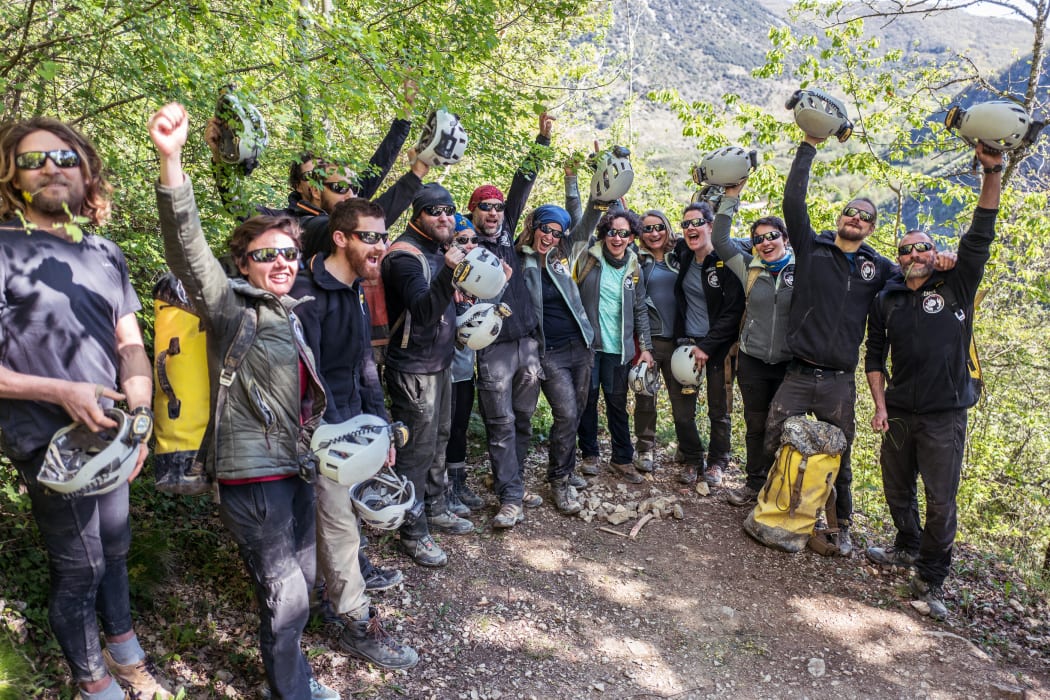 Volunteers celebrate after leaving the Lombrives cave where they have spent 40 days, in Ussat-les-Bains, southern of France