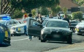 Police have arrested four people in Mission Bay after a member of the public stopped them holding what appeared to be firearms in a vehicle.