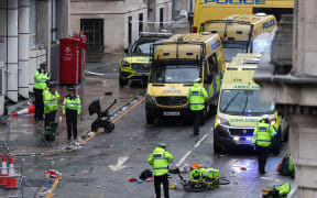 Police at the scene where a car hit pedestrians during Liverpool's Premier League title celebrations in the city centre, 26 May 2025.