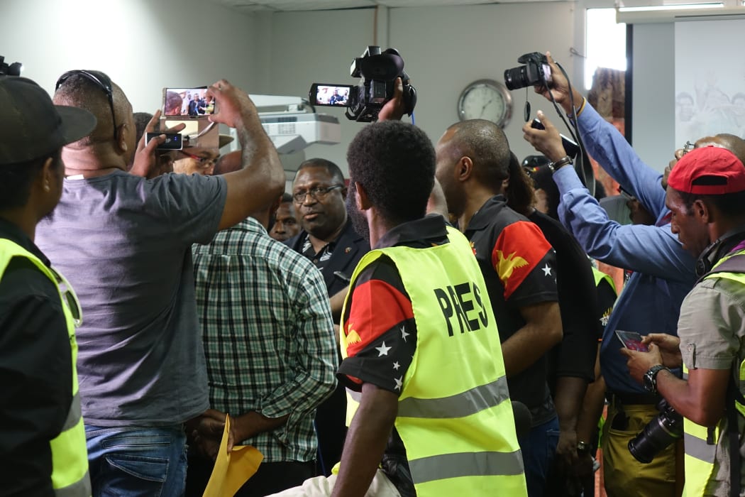 PNG Electoral Commissioner Patilias Gamato under pressure at a media conference