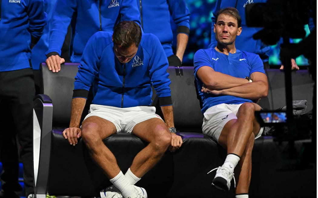 Switzerland's Roger Federer (L) sheds a tear after playing his final match, a doubles with Spain's Rafael Nadal (R) of Team Europe against USA's Jack Sock and USA's Frances Tiafoe of Team World in the 2022 Laver Cup at the O2 Arena in London.