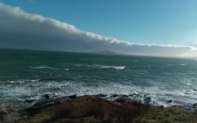 A glimpse across a stormy Foveaux Strait of oRakiura/Stewart Island.