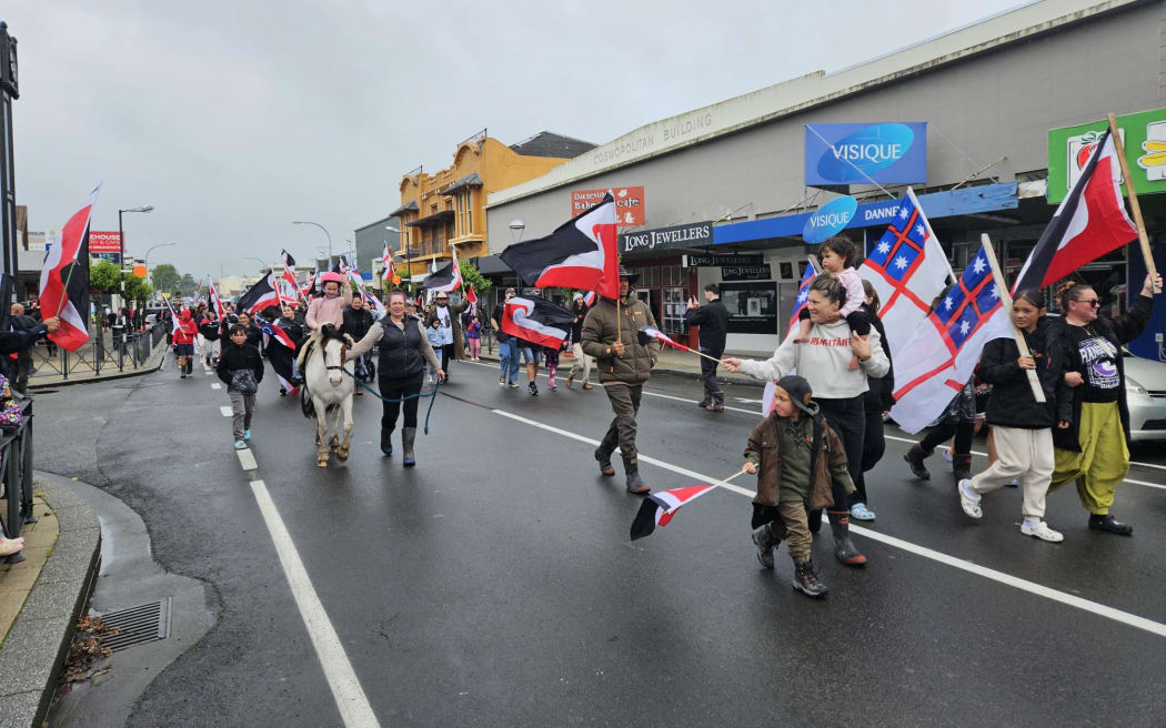 Protestors march through Dannevirke during day 6 of Hīkoi mō te Tiriti.