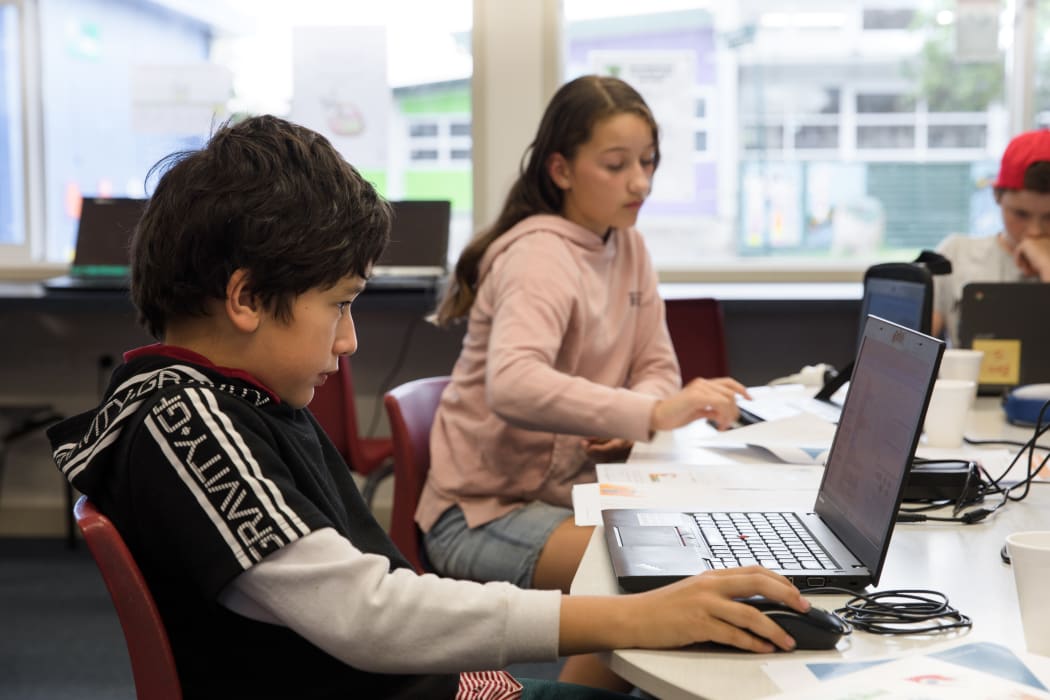 Davey, a member of the computer coding club set up by Ron Amosa, working on a coding exercise.