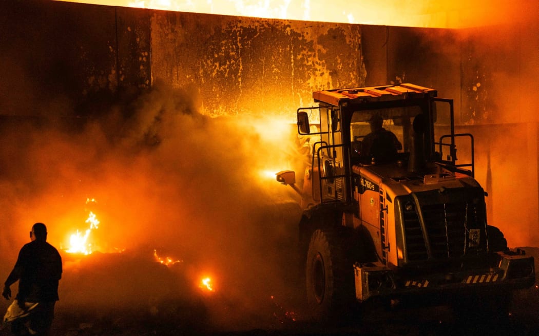 In the immediate aftermath of a fire, the government's Cabinet declared a plan to fast-track the building of a new parliament building.